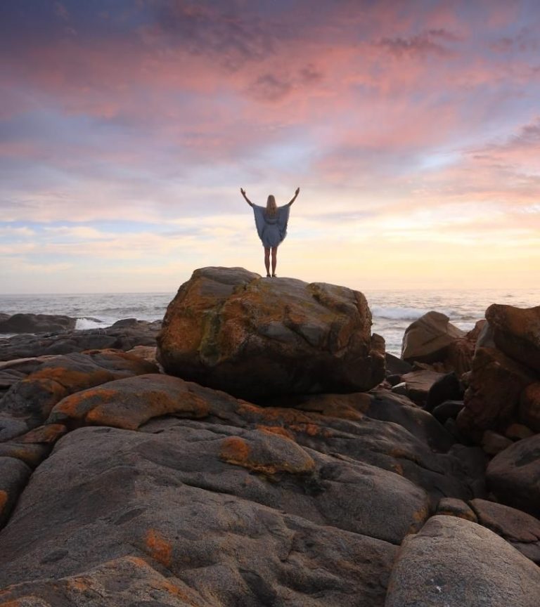 Adult on top of rock doing inner child healing therapy in Los Angeles